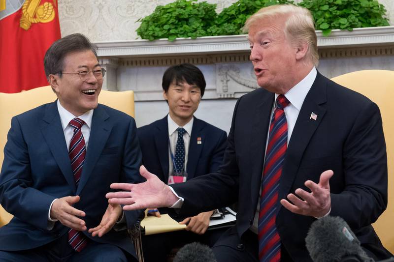 (FILES) In this file photo taken on May 22, 2018, US President Donald Trump and South Korean President Moon Jae-in hold a meeting in the Oval Office of the White House in Washington, DC. Trump sees "brilliant potential" in North Korea, he tweeted on May 27, 2018, continuing an upbeat tone about a planned summit with the North's leader Kim Jong Un. "I truly believe North Korea has brilliant potential and will be a great economic and financial Nation one day. Kim Jong Un agrees with me on this. It will happen!," said Trump, who had cancelled his June 12 meeting with Kim in Singapore, before reversing course within 24 hours.
 / AFP / SAUL LOEB
