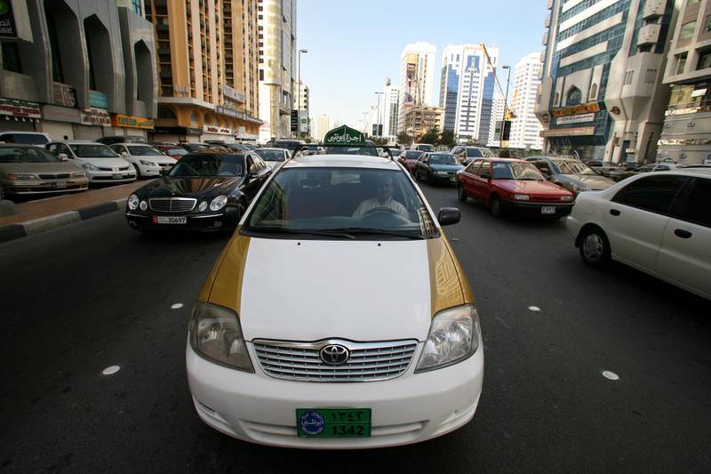 Abu Dhabi - April 1st 2008 -  A Taxi sits in traffic on in central Abu Dhabi (Andrew Parsons / The National) *** Local Caption *** AP007-0104-AD24.jpg
