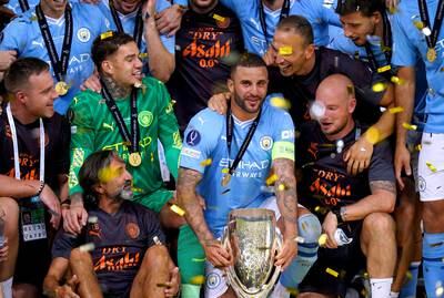 Manchester City's Kyle Walker holds the UEFA Super Cup trophy. PA