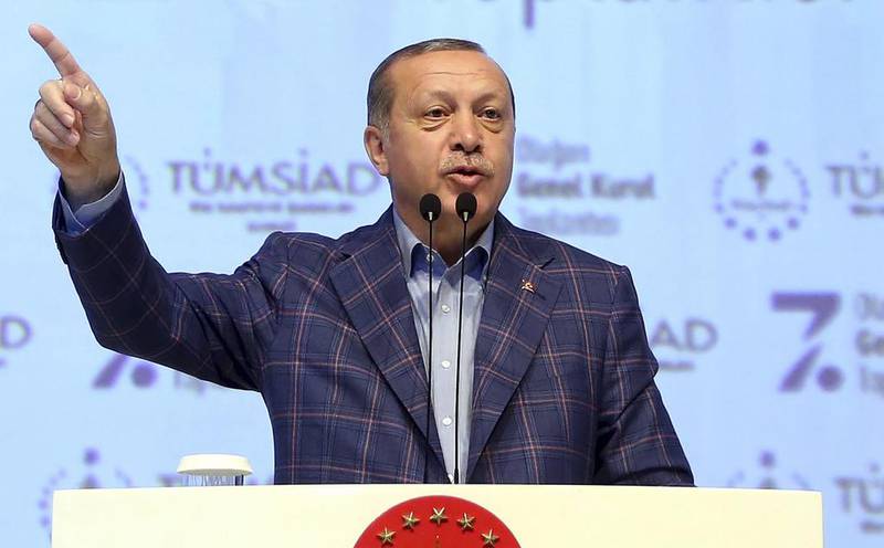 Turkey's president Recep Tayyip Erdogan delivers a speech at a conference in Istanbul on April 29, 2017, during which he said that, together, Ankara and Washington could turn Raqqa into an ISIL graveyard. Press Presidency Press Service via AP, Pool