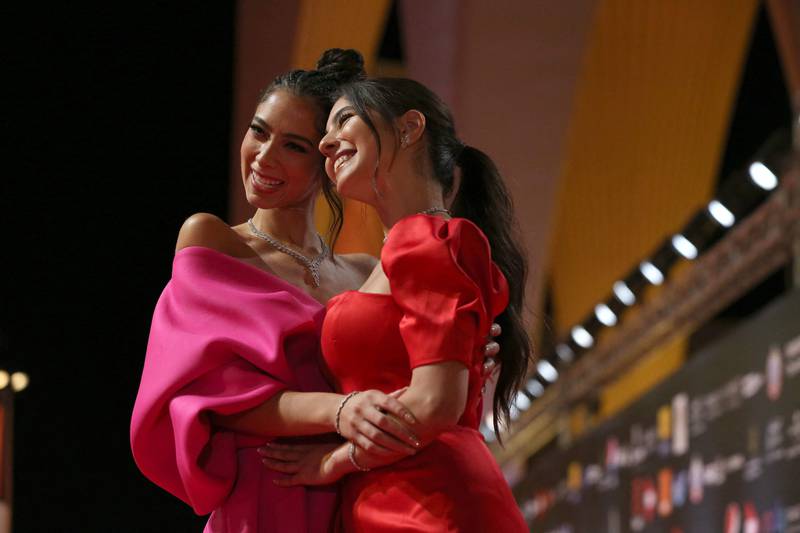 Egyptian actresses Dalia Shawki, left, and Mayan El Sayed pose on the red carpet