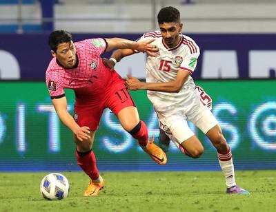 South Korea's Hee-Chan Hwang battles for possession with Mohammed Al Baloushi of the UAE. Reuters