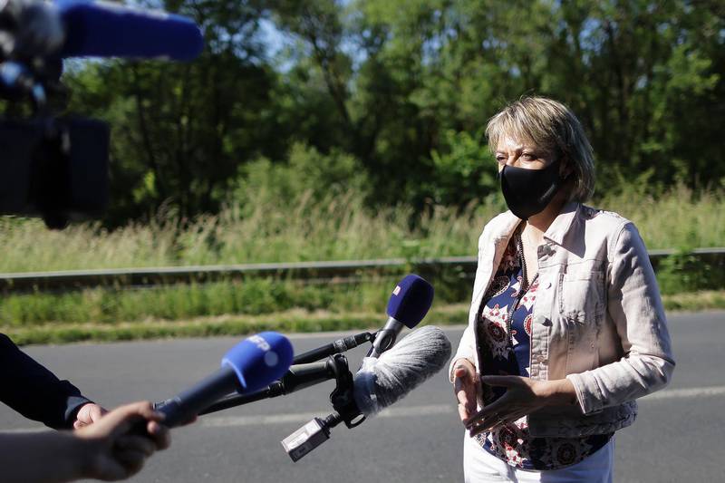 Mayor of Lardin-Saint-Lazarre, Francine Bourra, speaks to the press during the hunt for an armed man in four square kilometres of woodland in the Dordogne, south-western France. AFP
