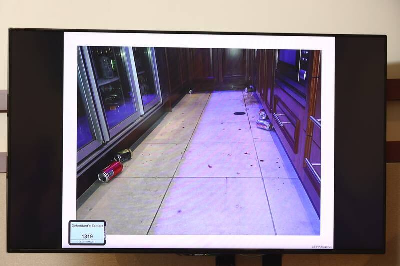 Pictures of shattered glass presented as evidence by Amber Heard's defence team. EPA