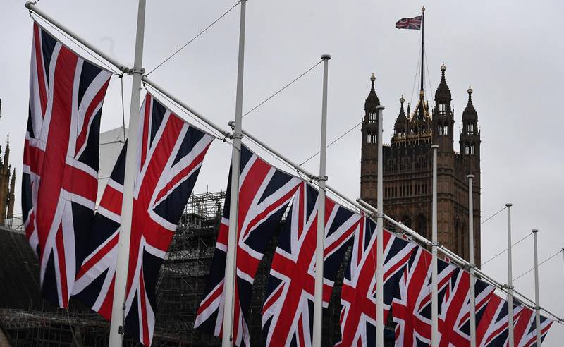 Union flags line parliament square in London. EPA
