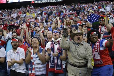 Fans of United States celebrate at the end a Copa America Centenario quarterfinal soccer match against Ecuador, Thursday, June 16, 2016 at CenturyLink Field in Seattle. United States won 2-1. (AP Photo/Elaine Thompson)