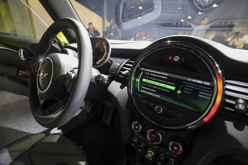 Charging information is displayed on the dashboard. Bloomberg