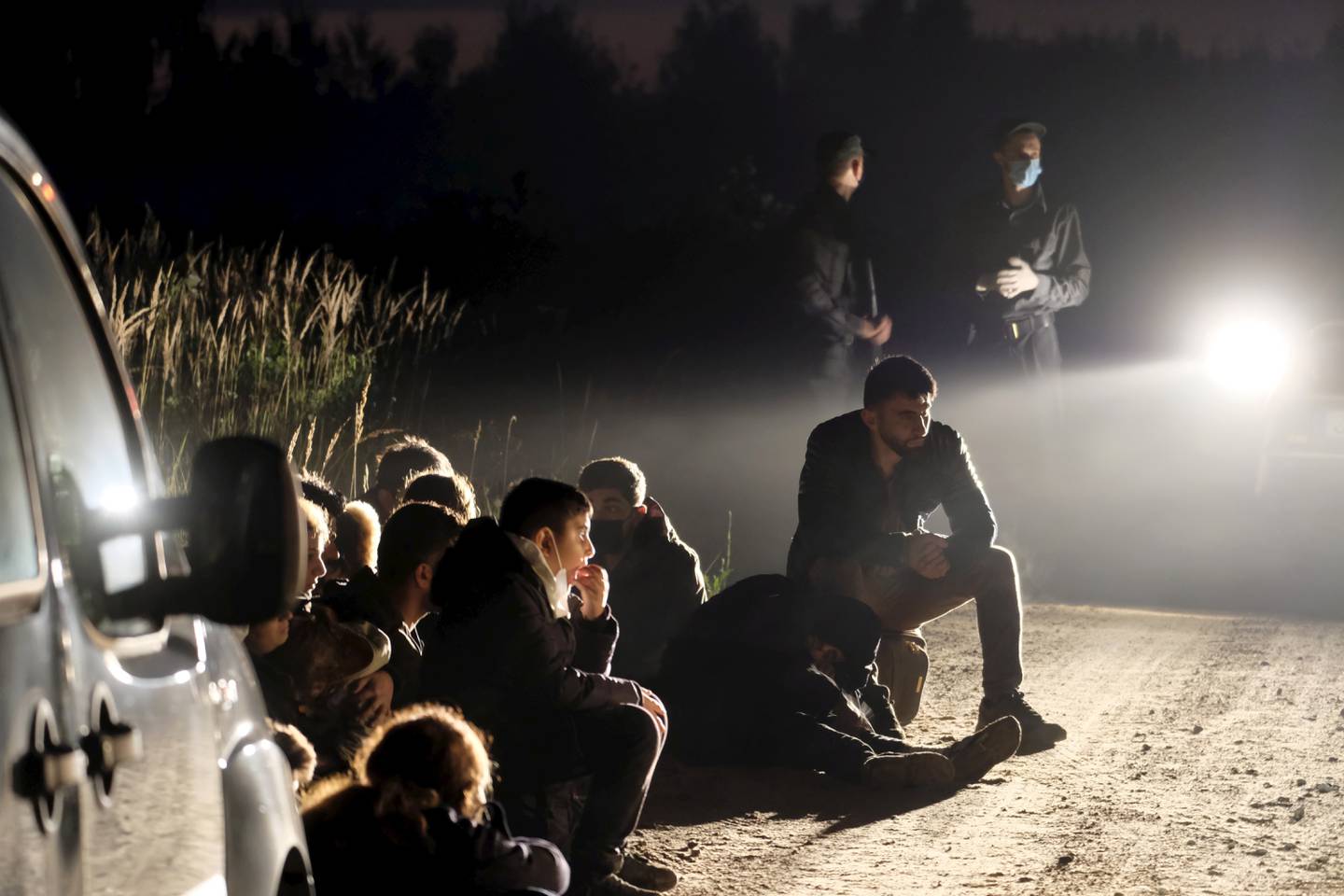 A group of migrants who were detained in Vorzova, Latvia, after the country declared a state of emergency on the border. EPA 