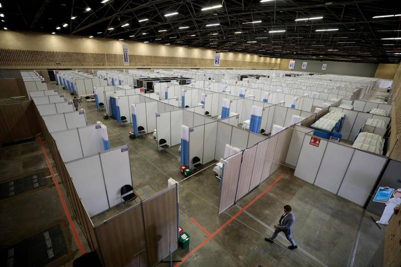 A man walks through a field hospital set up inside the Corferias convention center in Bogota, Colombia. AP Photo