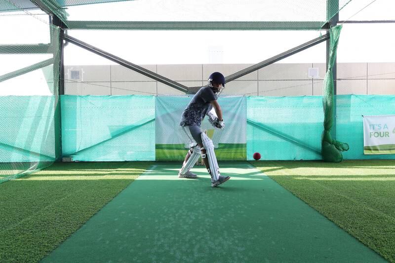 Dhamecha practises his batting form in the cricket nets.