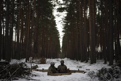 Ukrainian servicemen in position close to the border with Belarus in February 