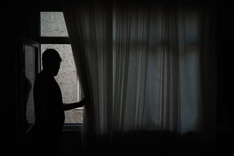 The 12 Afghan residents of a two-room apartment in Zeytinburnu barely leave for fear they will be caught by Turkish authorities and deported. They keep the curtains drawn at all times so no one can see in. Yunus Emre Caylak for The National