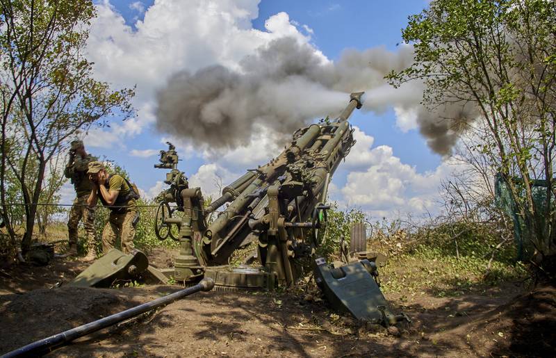 Ukrainian troops in the Kharkiv area of Ukraine fire a American-made 155mm M777 towed howitzer. EPA