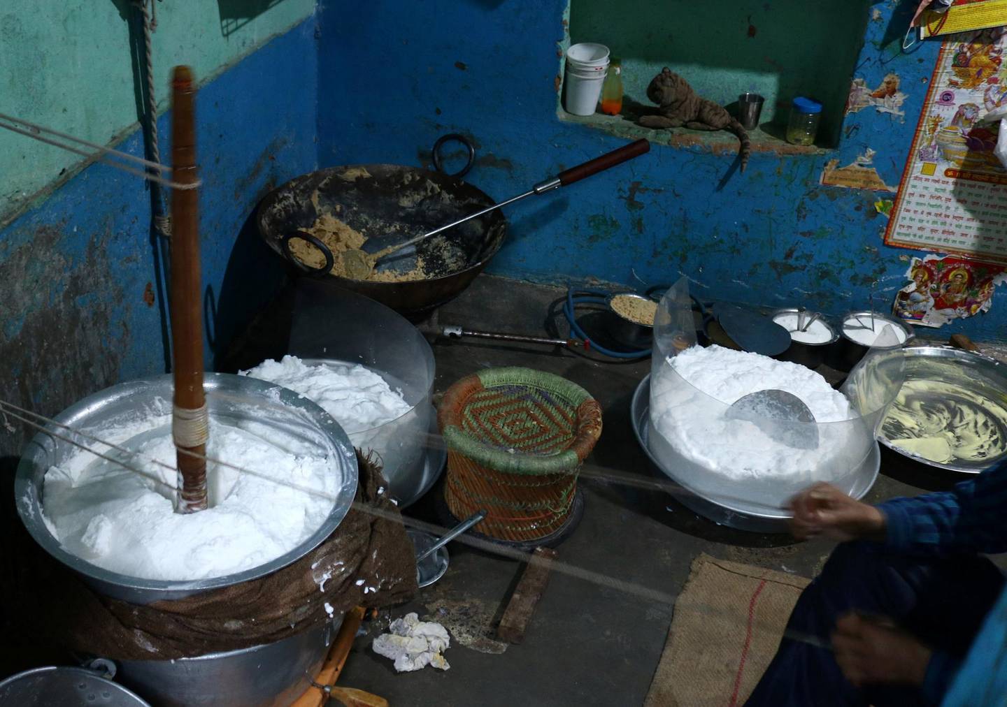 The milk is churned using a hand-held wooden mallet, and takes up to four hours to achieve the frothy consistency for daulat ki chaat. Photo: Rakesh Kumar