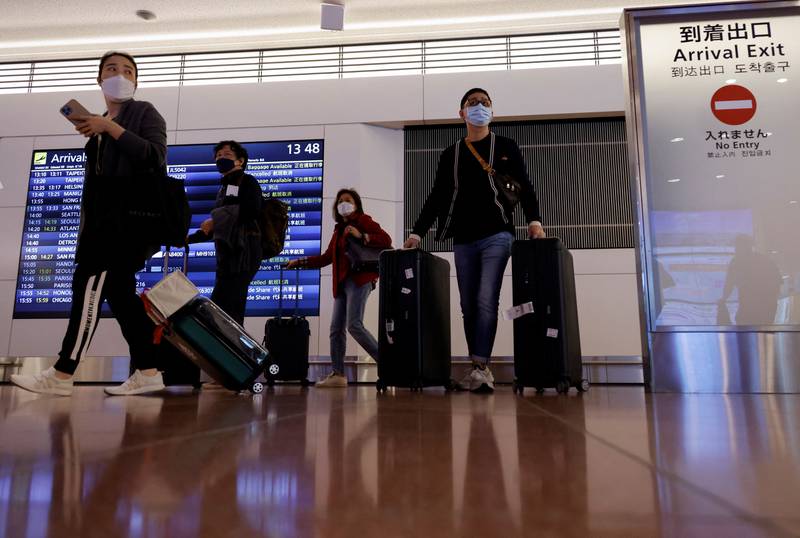 Passengers arrive at Haneda International Airport as Japan welcomes tourists again. Reuters