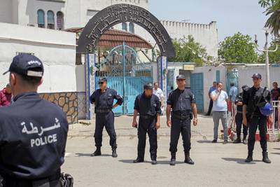 In this file photo taken on June 13, 2019, Algerian policemen guard the El Harrach prison in the suburbs of the capital Algiers. AFP