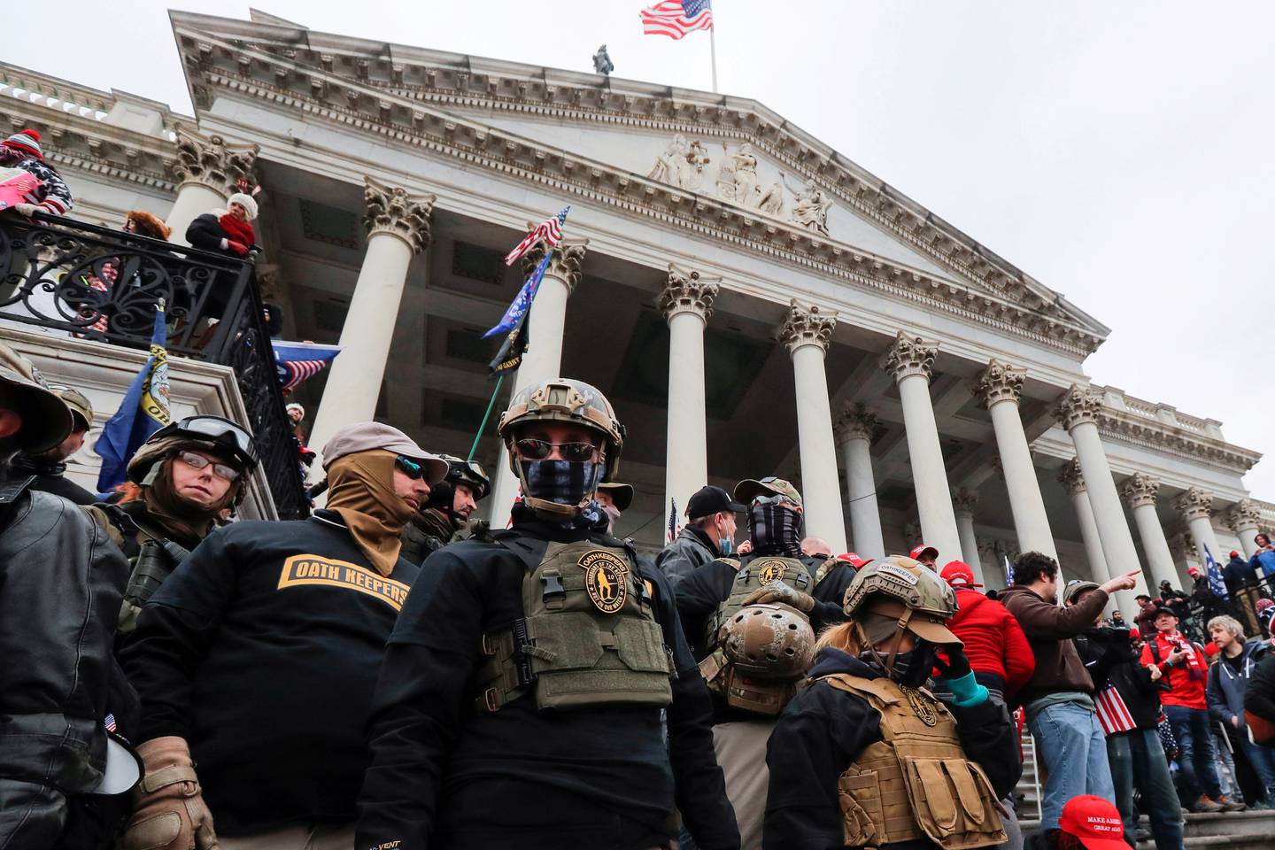 Members of the Oath Keepers militia group stand among supporters of Donald Trump on the steps of the US Capitol in Washington, January 6. Reuters