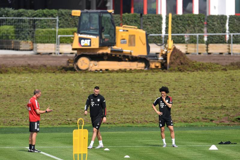 Bayern Munich's Leroy Sane, right, Niklas Sule and assistant coach Holger Broich during training on Wednesday, July 15. Reuters
