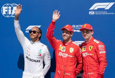 Sebastian Vettel, centre, alongside Mercedes driver Lewis Hamilton and Ferrari teammate Charles Leclerc after Canadian Grand Prix qualifying. AP Photo