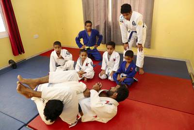 ABU DHABI, UNITED ARAB EMIRATES , April 22– 2020 :- Khaled Al Awlaqi, former Jiu Jitsu player giving training to his seven sons Mahdi (17), Faraj (15), Mohammed (14), Altheeb (8), Mubarak (6), Abdullah (6) and Omar (5) at his home in Baniyas area in Abu Dhabi.  (Pawan Singh / The National) For Sports/Online. Story by Amith