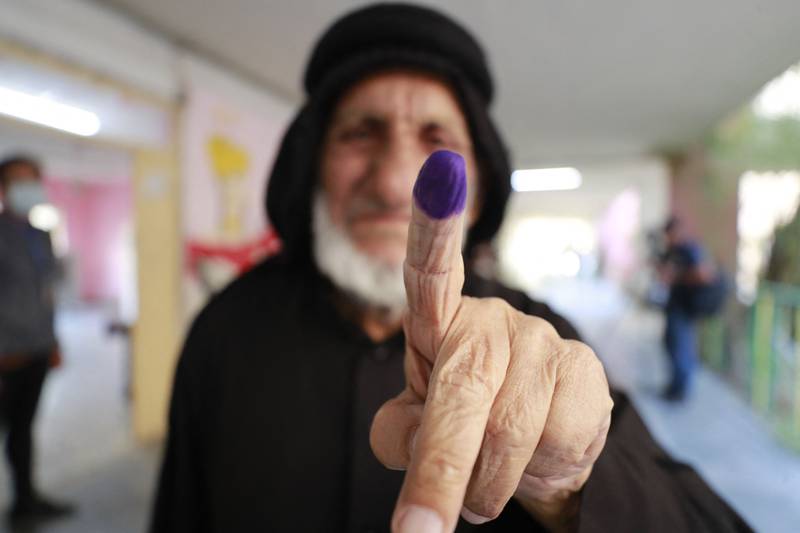 An Iraqi voter displays his inked finger after casting his ballot at a polling station in Baghdad, in an early parliamentary election billed as a concession to anti-government protests. It is expected to be boycotted by many voters who distrust official promises of reform. Photo: AFP