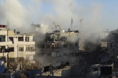 Smoke rises from damaged buildings during what activists said were clashes between Free Syrian Army fighters and the forces of Syria's President Bashar Al Assad in Jobar, a suburb of Damascus on January 4, 2015. Msallam Abd Albaset /Reuters 