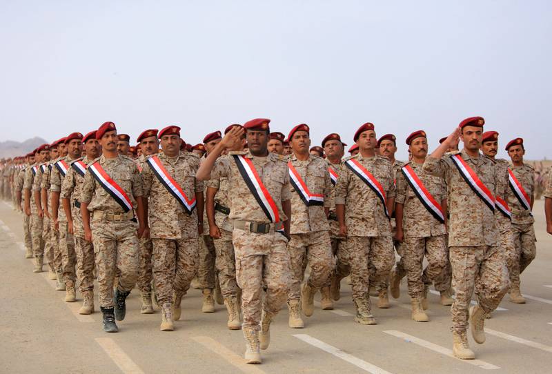 Fighters loyal to Yemen's Saudi-backed government take part in a military parade marking the 56th anniversary of the 1962 revolution that established the Yemeni republic, in the country's northeastern province of Marib.
