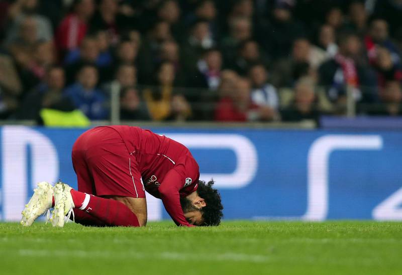 Salah celebrates after scoring. Luis Vieira / AP Photo