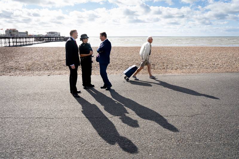 Shadow home secretary Nick Thomas-Symonds, left, is joined by Keir Starmer as they meet members of the Sussex Police force on a walkabout in Worthing. PA