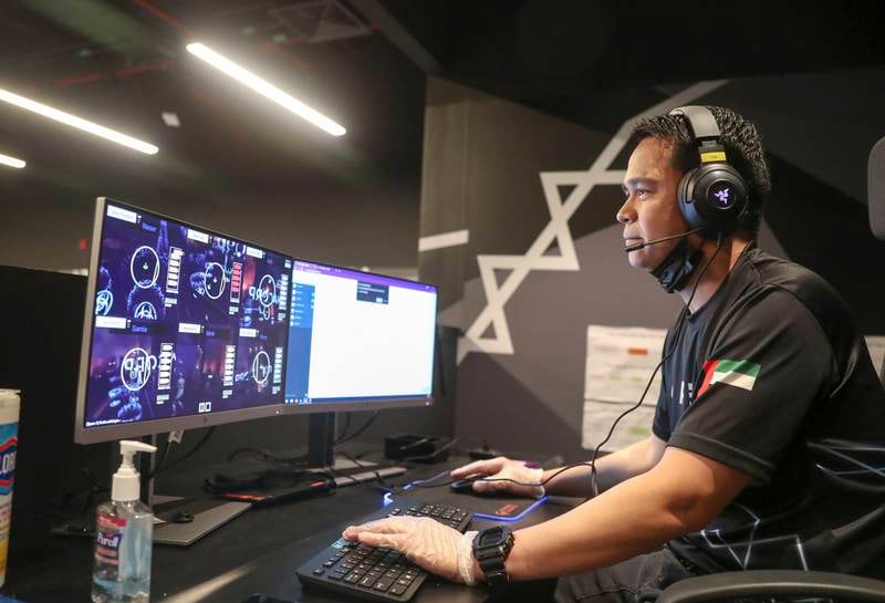 A staff member controls the game at Zero Latency, a free-roam multiplayer virtual reality entertainment site at The Galleria on Al Maryah Island
