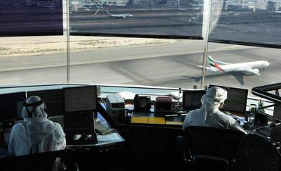 Air-traffic controllers keep track of aircraft movements in the visual control room at the top of the air traffic control centre at Dubai International Airport. Stephen Lock / The National. 