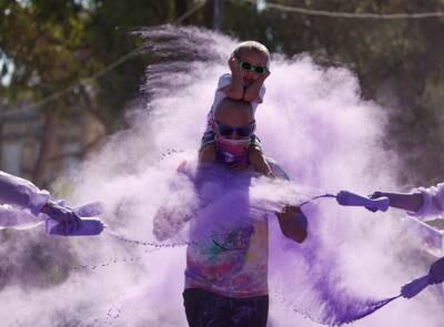Participants covered in powder during the 'Colour My Run' charity fun run in Ta' Xbiex, Malta. Reuters