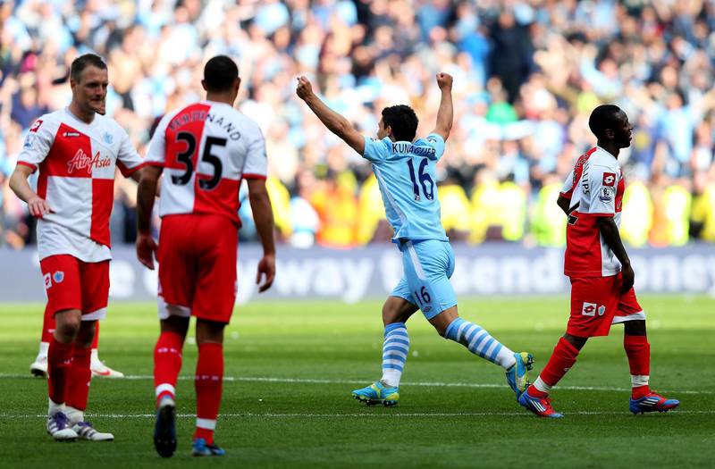 MANCHESTER, ENGLAND - MAY 13:  Sergio Aguero #16 of Manchester City celebrates winning the title as the final whistle blows during the Barclays Premier League match between Manchester City and Queens Park Rangers at the Etihad Stadium on May 13, 2012 in Manchester, England.  (Photo by Alex Livesey/Getty Images)