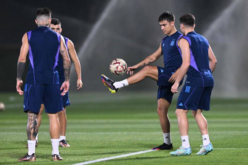 Argentina forward Paulo Dybala (2R) takes part in a training session at Qatar University. AFP
