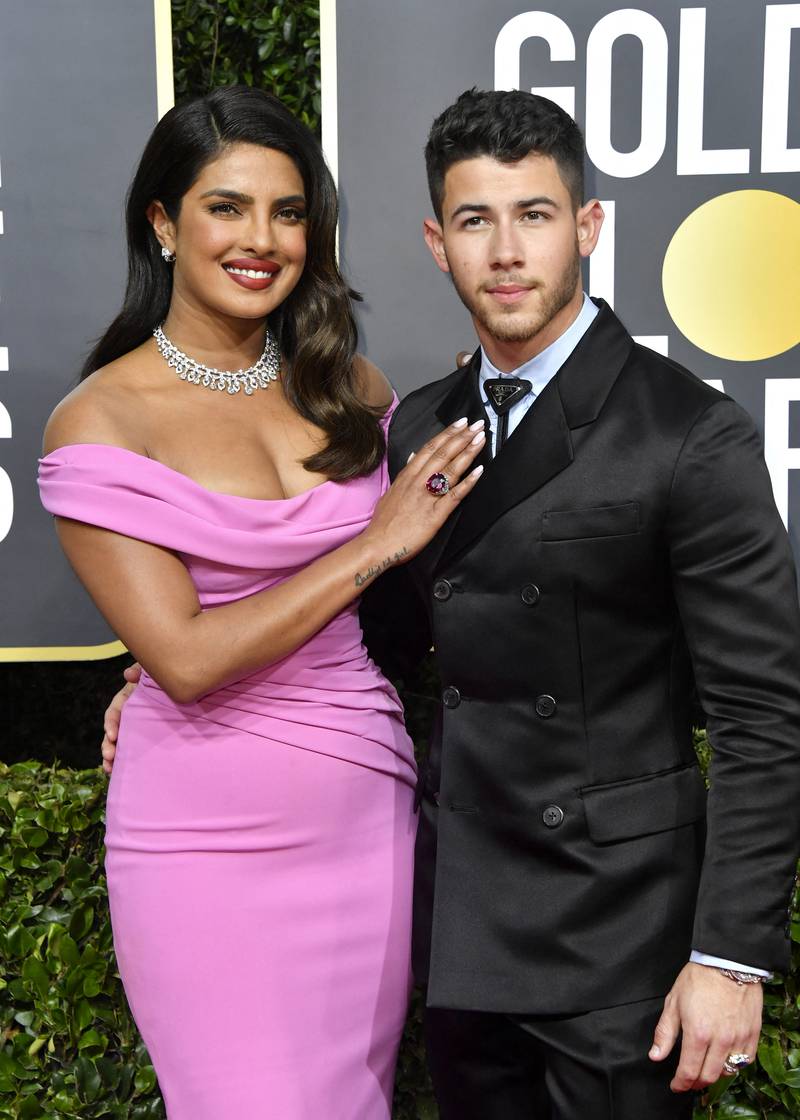 Priyanka Chopra, left, marked husband Nick Jonas's first Father's Day with a heartfelt Instagram post. AFP