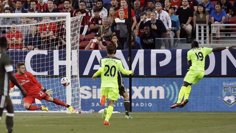 AC Milan goalkeeper Gabriel, left, stops a shot on goal from Liverpool’s Sadio Mane (19) during the first half of an International Champions Cup match Saturday, July 30, 2016, in Santa Clara, California. Marcio Jose Sanchez / AP Photo
