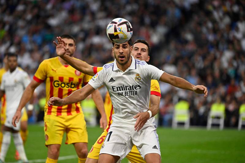 Real Madrid's Spanish midfielder Marco Asensio eyes the ball during the Spanish league football match between Real Madrid CF and Girona FC at the Santiago Bernabeu stadium in Madrid on October 30, 2022.  (Photo by PIERRE-PHILIPPE MARCOU  /  AFP)