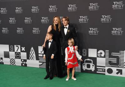Real Madrid and Croatian midfielder Luka Modric, his wife Vanja Bosnic and their children Ivano and Emma arrive for the awards in London.  EPA