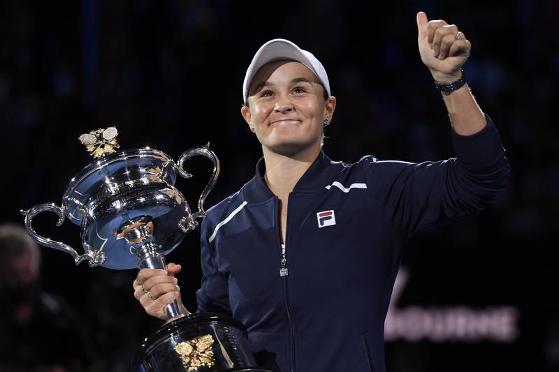 Australia's Ashleigh Barty holds the Daphne Akhurst Memorial Cup after defeating Danielle Collins in the Australian Open final on Saturday, January 29, 2022. AP