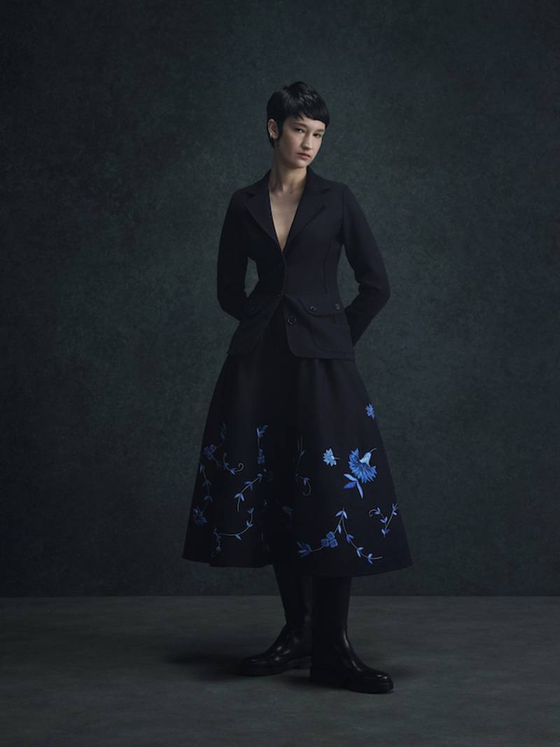 A sculpted jacket and embroidered skirt.