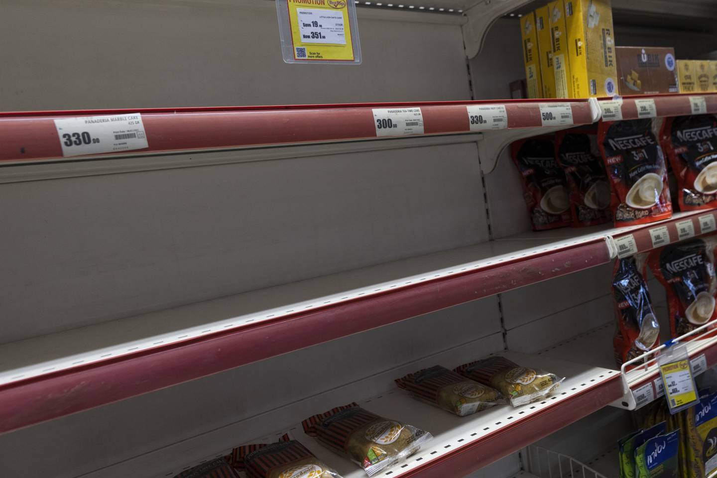 Empty shelves at a supermarket in Colombo. Bloomberg