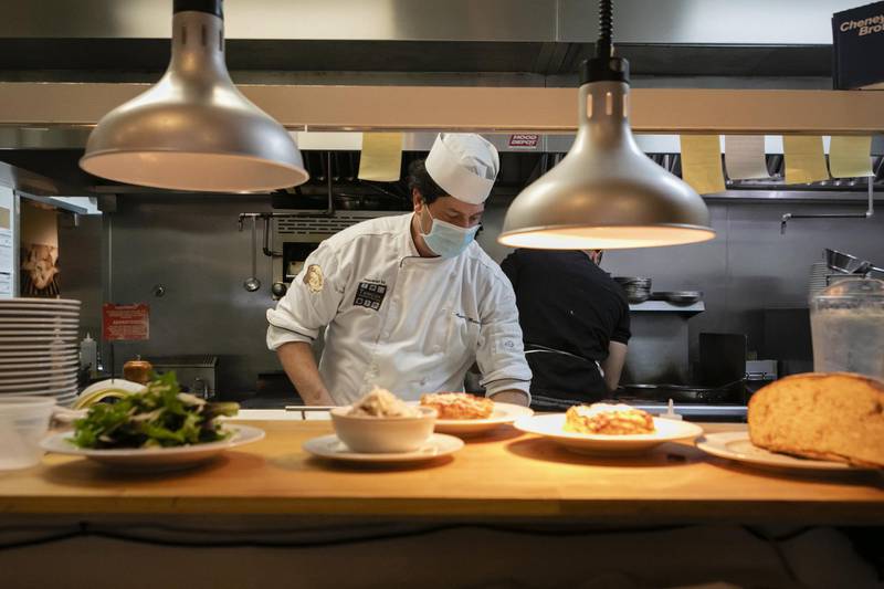 A chef prepares food at a restaurant in Miami, Florida, US. Bloomberg