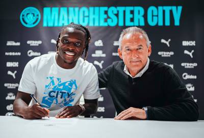 New Manchester City signing Jeremy Doku, left, with director of football Txiki Begiristain. Photo: Manchester City FC