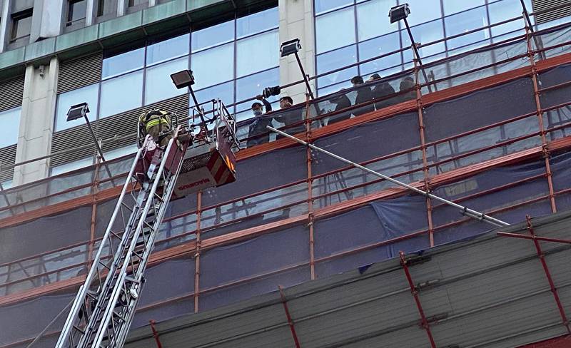 People rescued at the World Trade Centre in the popular Causeway Bay shopping district of Hong Kong. Dozens of people were trapped on the rooftop of the skyscraper after a major fire broke out on Wednesday. AP Photo
