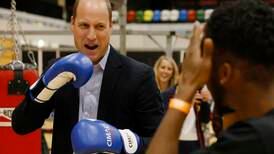 Prince William boxes in his suit at sports charity anniversary