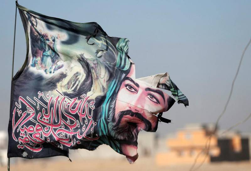 A flag of Imam Hussein is seen on an Iraqi special forces soldiers in Mosul, Iraq.