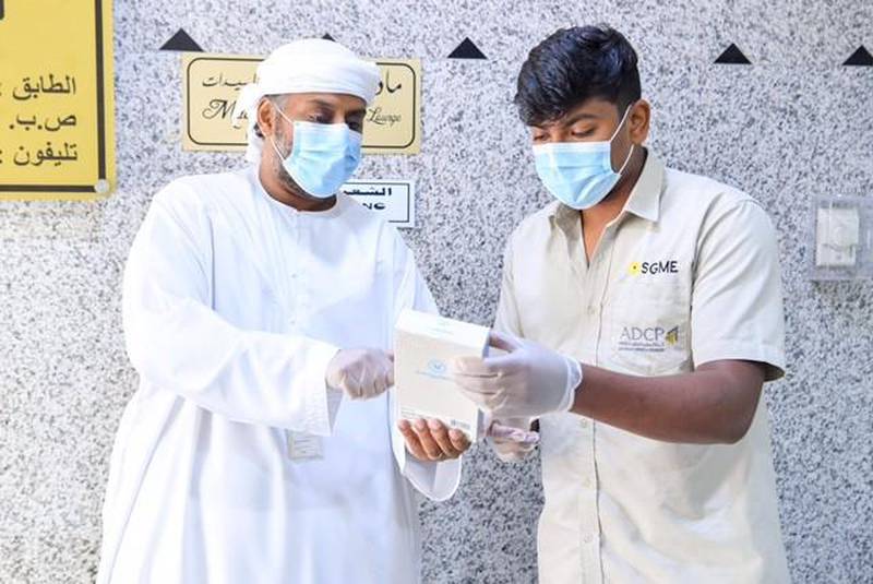 Abu Dhabi Municipality educates security guards in residential buildings about reporting suspected Covid-19 cases. Courtesy: Abu Dhabi Municipality.