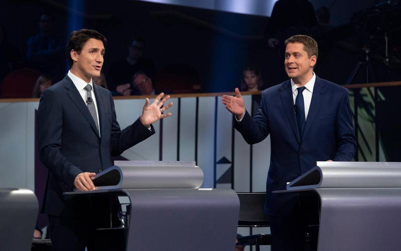 epa07911660 Canadian Prime Minister and Liberal leader Justin Trudeau (L) and Conservative leader Andrew Scheer (R) take part in a federal political leaders debate in Gatineau, Quebec, Canada, 10 October 2019. Canadians will vote in the country's 43rd general election on 21 October 2019.  EPA/ADRIAN WYLD / POOL