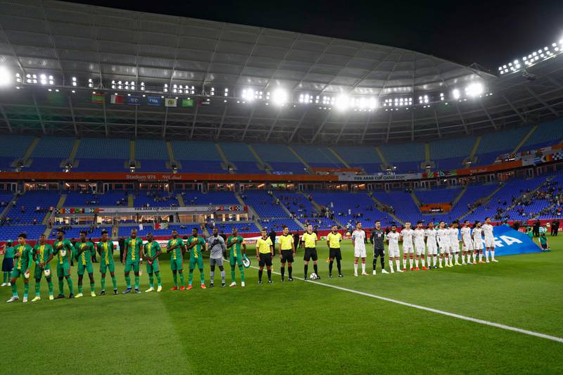 Players line up for the national anthems.