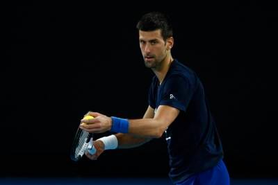 Novak Djokovic serves during a practice session ahead of the 2022 Australian Open at Melbourne Park. Getty Images
